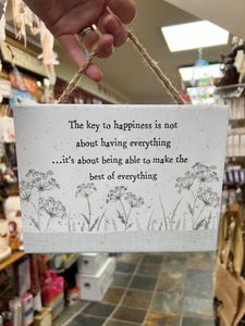 The key to happiness sign